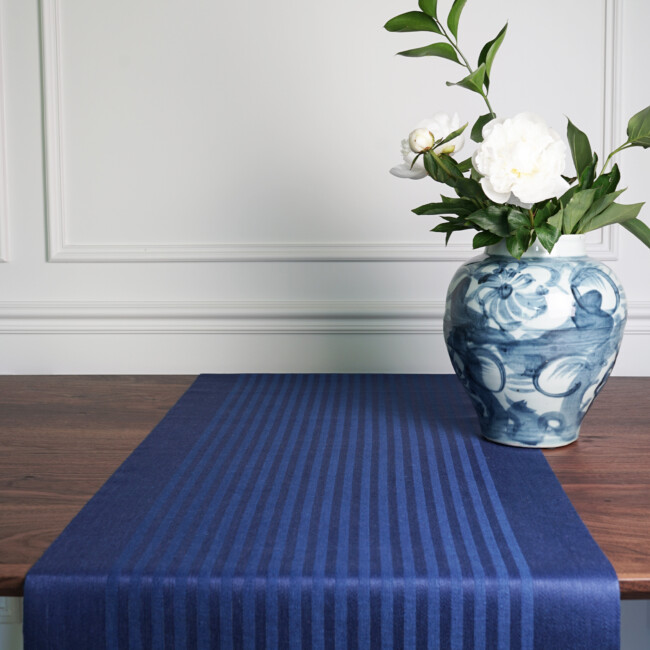 Product image of both table runners, class balls, linen fabric, hanve hanne . Located on a brown dining room table, made of class ball&#39;s linen fabric